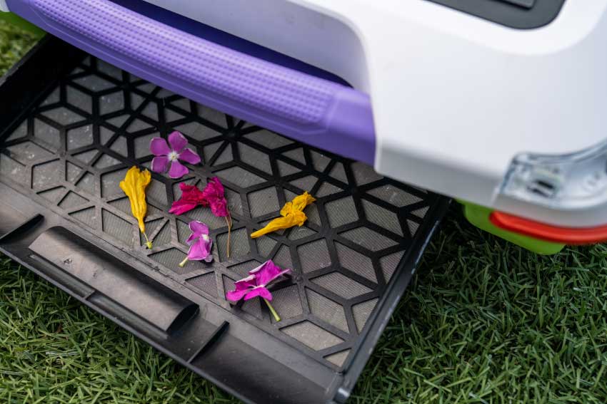 up close shot of debris tray of ariel robot showing flowers