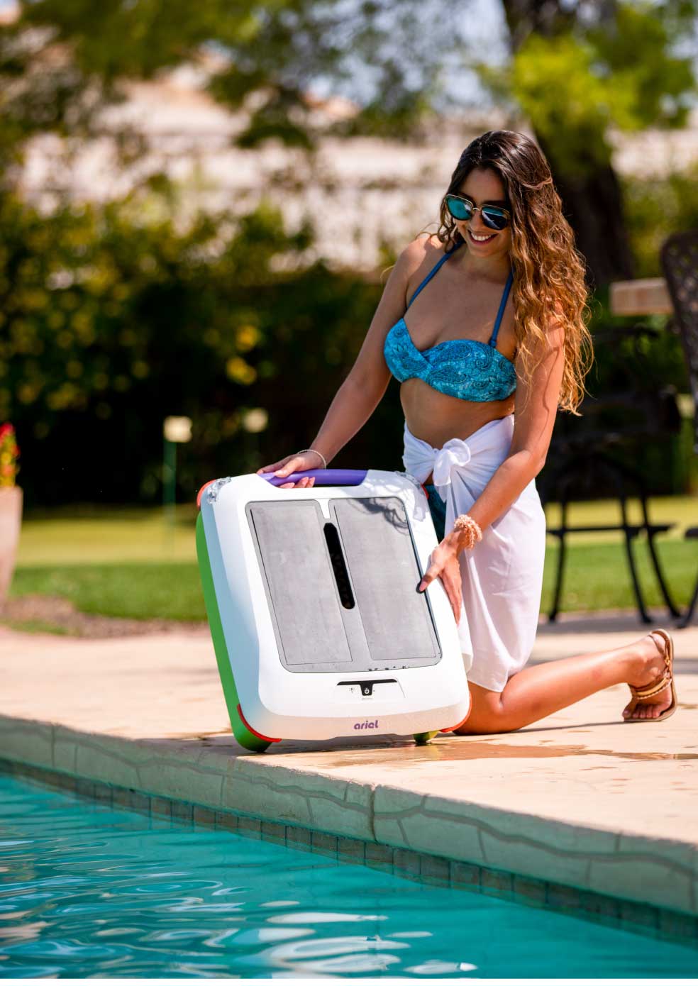 girl poolside holding ariel robot so solar panels face the viewer