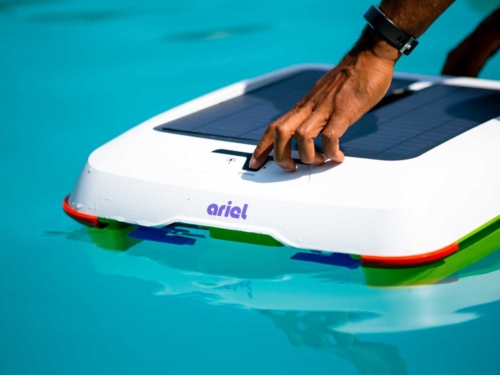 pushing the power button of ariel robot pool cleaner